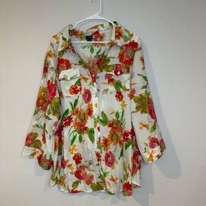 Women’s cream blouse in a 3X‎ with multicolored flowers. Made of 100% polyester.